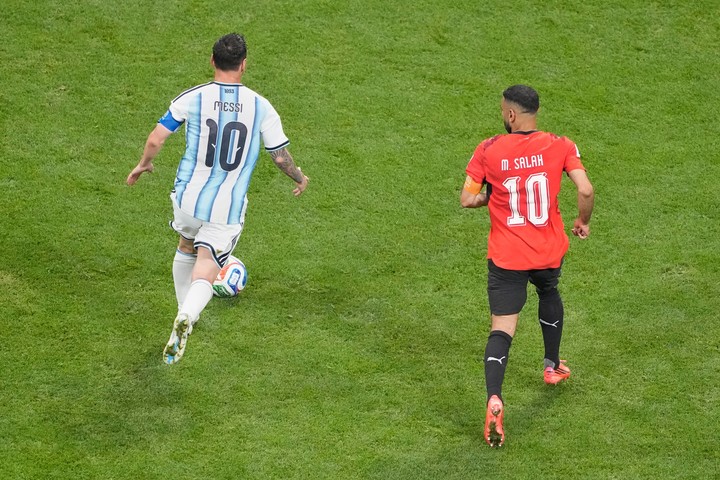 Mohamed Salah vs. Lionel Messi. (AP)